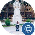 This is a picture of a student in a wheelchair in front of a fountain. They want to know where to go next.