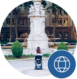 find-your-place This is a picture of a student in a wheelchair in front of a fountain. They want to know where to go next.